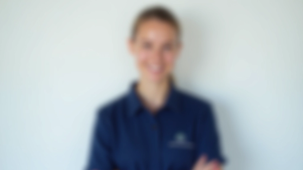 Female professional cleaner in service uniform with warm smile